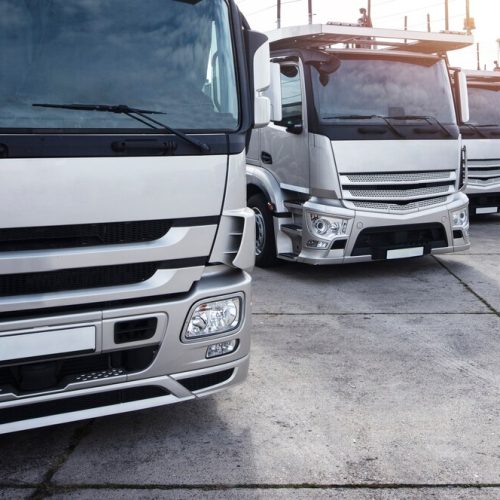 group-trucks-parked-row_342744-533